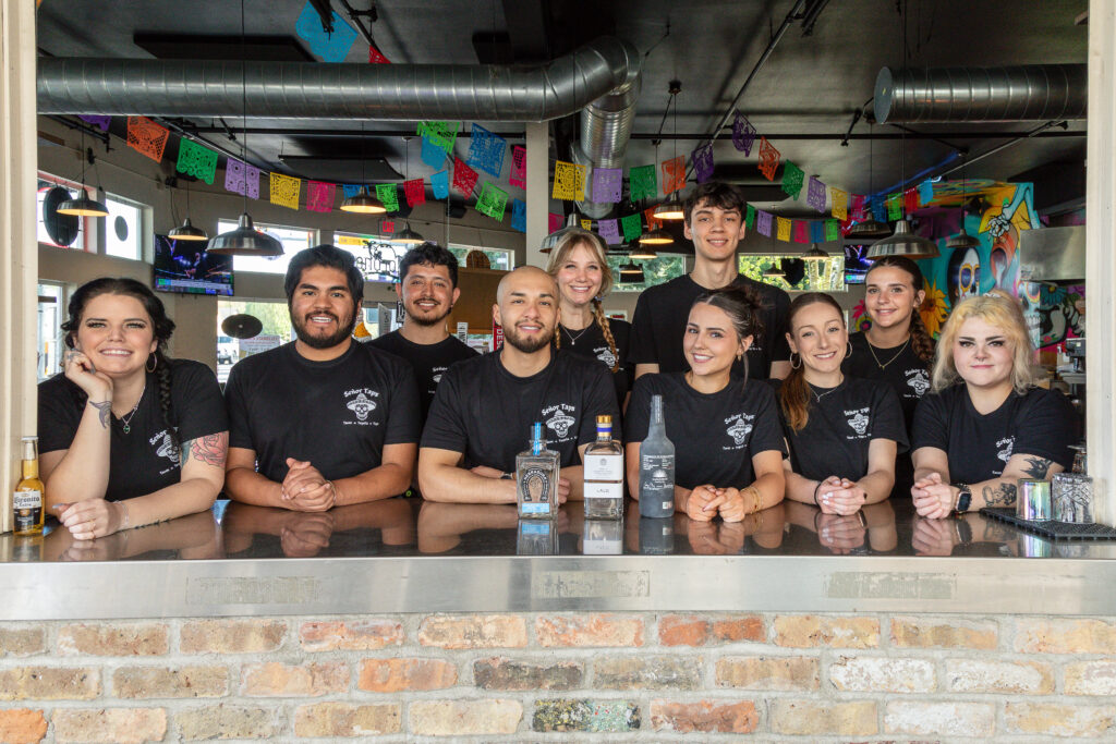 Señor Taps team behind the restaurant bar